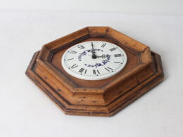 Horloge murale en bois et métal